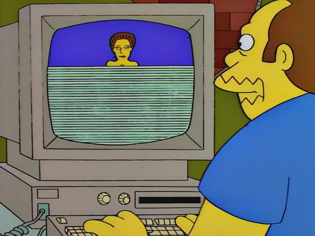 Comic book guy from The Simpsons slowly loading an image on his computer